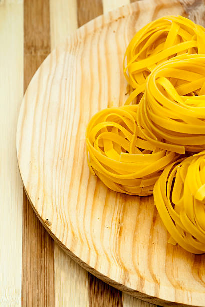 Italian noodle nest on wooden