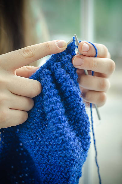 istock female hands hold knitting needles and crochet 509312916