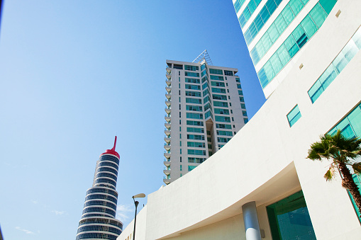 Top of a building with deep blue sky.