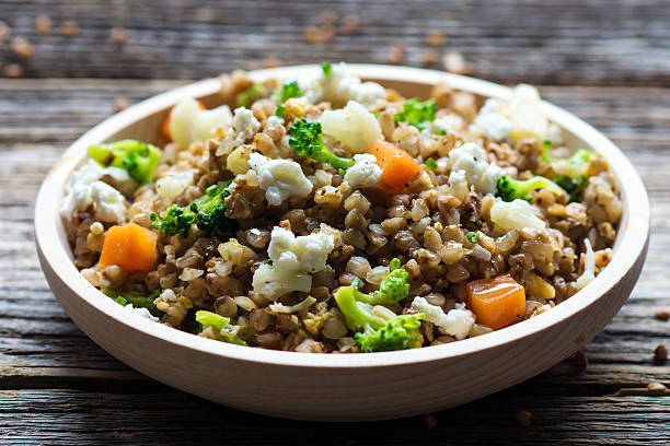 istock Buckwheat with  vegetables and feta cheese 509313564