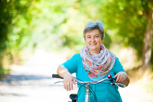 istock Senior woman riding bicycle 509314388