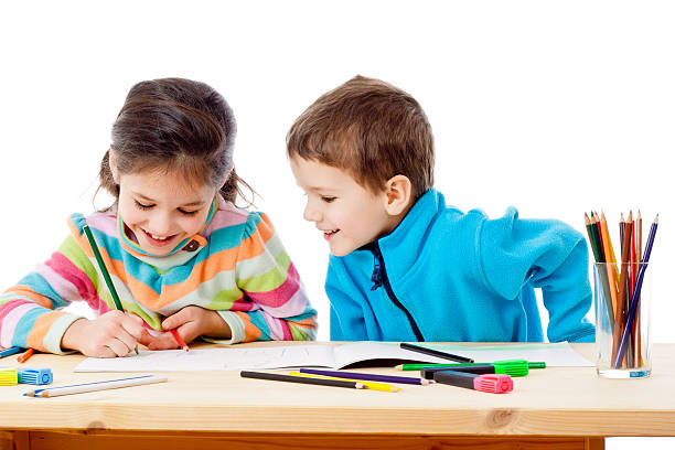 istock Two little kids draw with crayons 509315814