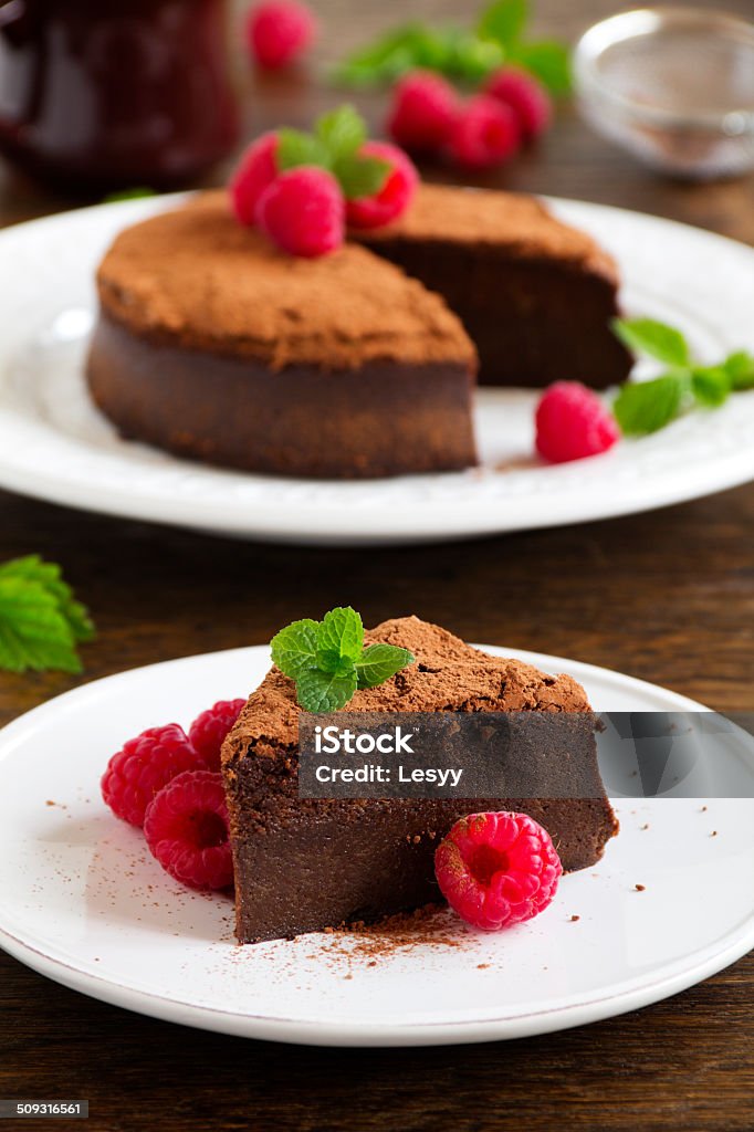 Truffle chocolate cake with raspberries. Baked Pastry Item Stock Photo