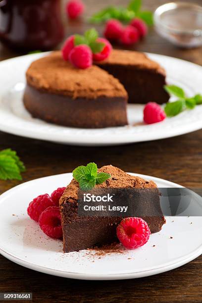 Truffle Chocolate Cake With Raspberries Stock Photo - Download Image Now - Baked Pastry Item, Bakery, Baking