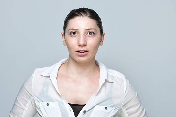 istock real young woman surprised portrait isolated on grey 509316574