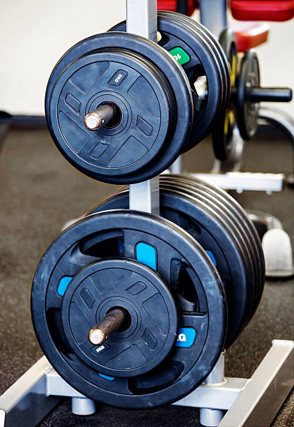 istock Barbell plates holder in gym 509317374