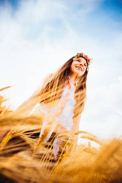 istock Young Girl WalkingThrough Wheat Fields 509317477