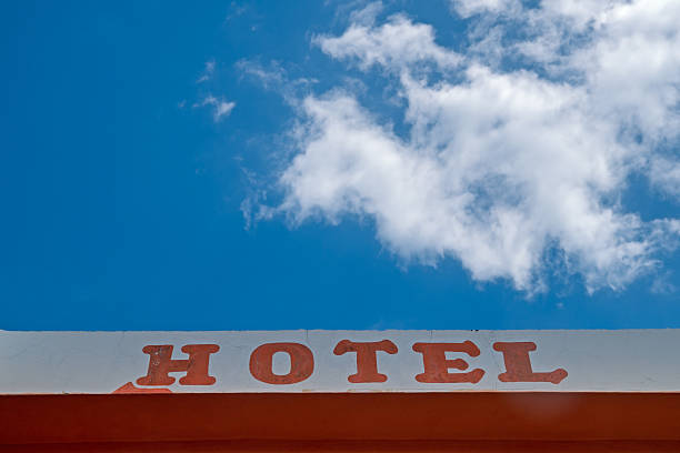 istock Hotel sign, text at building facade wall 509317623