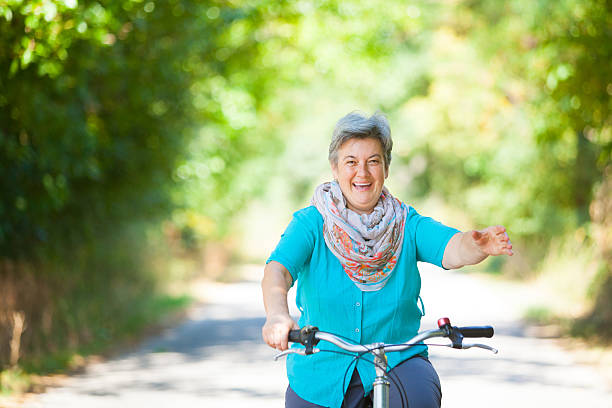 istock Senior woman riding bicycle 509318194