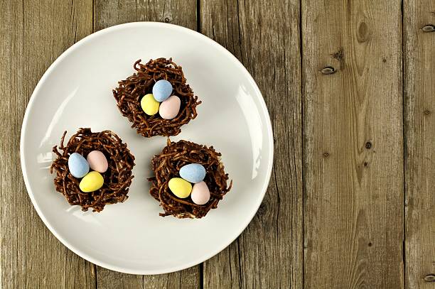 istock Plate of chocolate spring nests on rustic wood 509318810