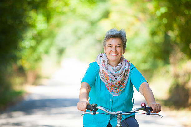 istock Senior woman riding bicycle 509319088