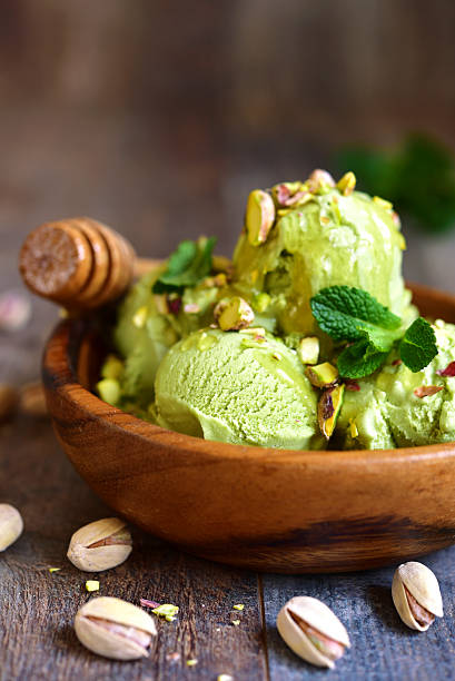 istock Pistachio ice cream with chopped nuts and honey. 509319338