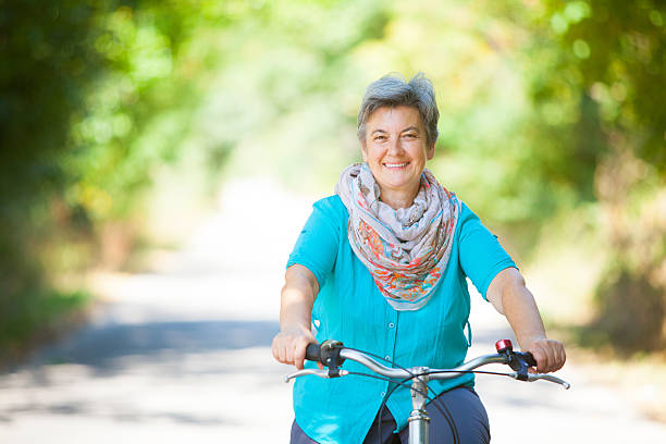 istock Senior woman riding bicycle 509319358