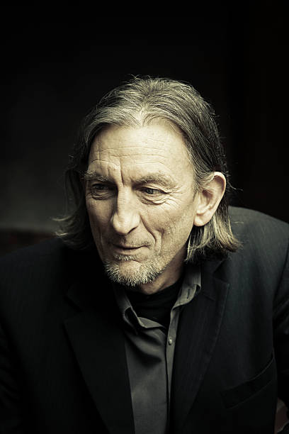 istock Mature man with long hair and beard stubble 509320657