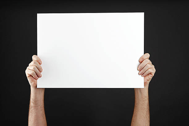 istock Man holds up poster 509321257