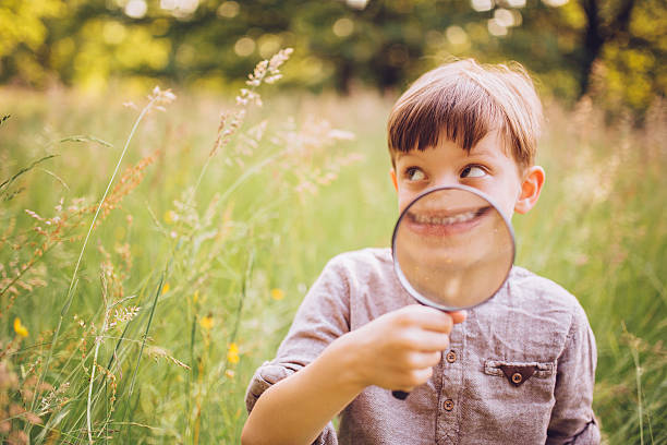 istock Vintage Boy with Magnifying Glass 509322681