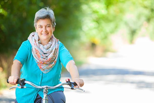 istock Senior woman riding bicycle 509341650