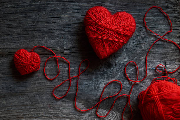 istock Valentine day postcard mockup with wool handmade red hearts 509342730