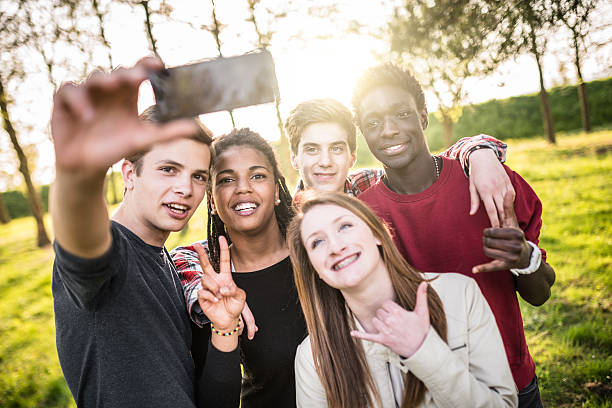 istock Group of college student laughing and doing a selfie 509342868