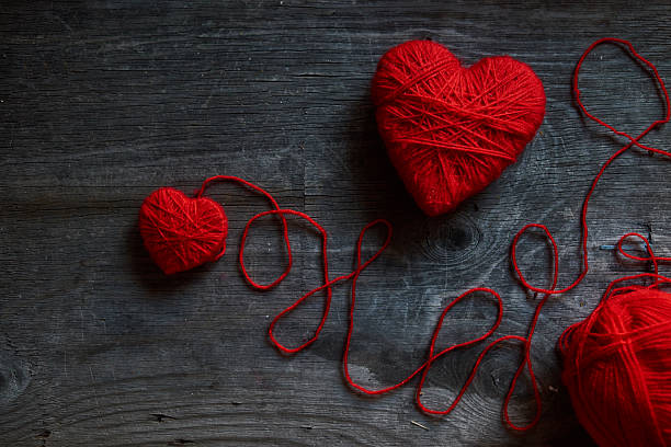 istock Valentine day postcard mockup with wool handmade red hearts 509342906