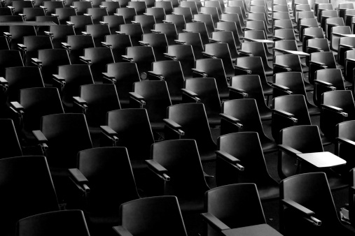 Rows of empty seats in an auditorium, concert venue, conference hall or theatre
