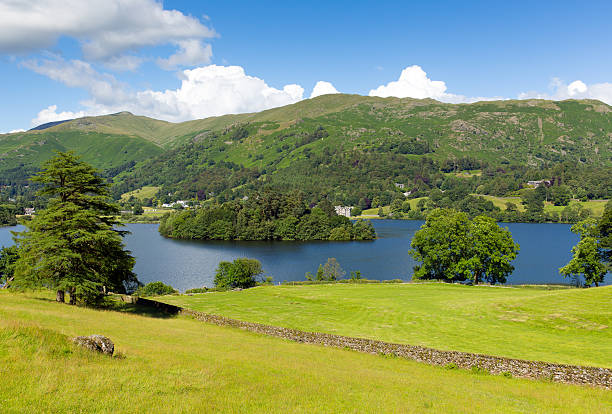 istock Grasmere Lake District Cumbria England UK with blue sky mountains 509343383
