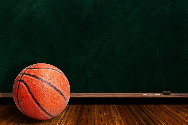 istock Game Concept With Rugged Basketball and Chalk Board Background 509343786