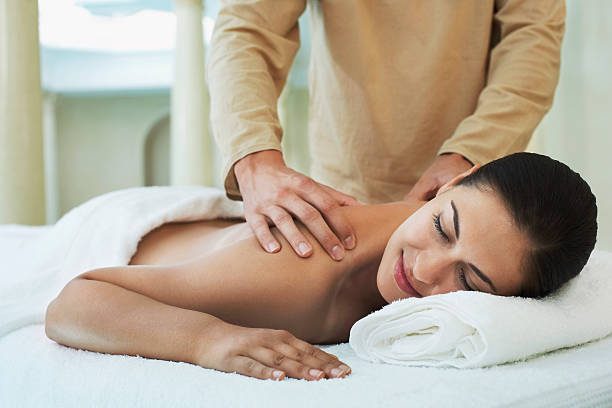 istock Woman Receiving Shoulder Massage By Masseuse 509344065