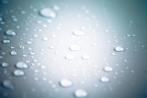 istock Drops of water on a color background. Toned gray 509344438