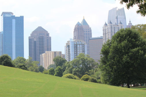 A view of Atlanta midtown buildings from inner city piedmont park