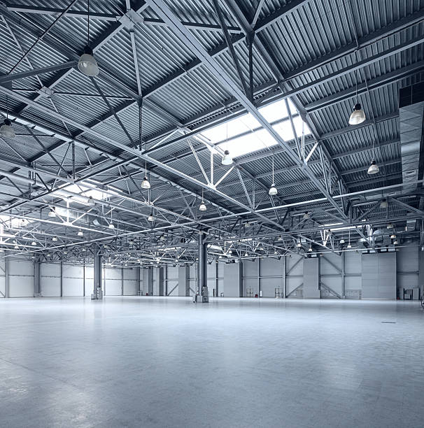 Modern empty storehouse Interior of empty warehouse industrial building stock pictures, royalty-free photos & images