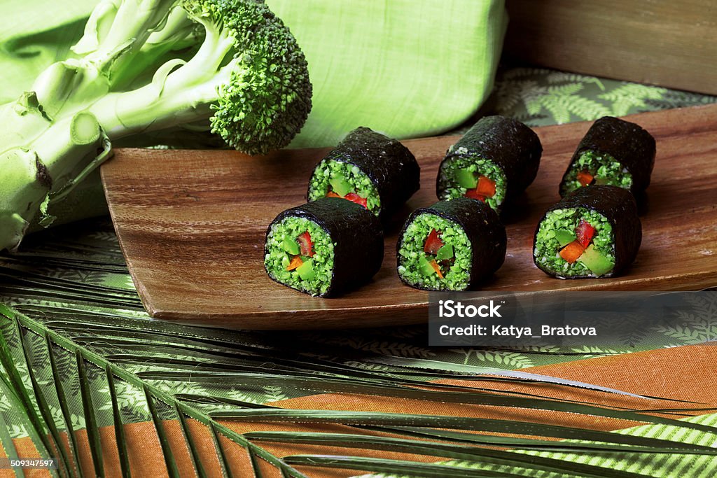 raw food rolls raw food rolls of buckwheat, broccoli, cucumber and pepper in a still life Appetizer Stock Photo