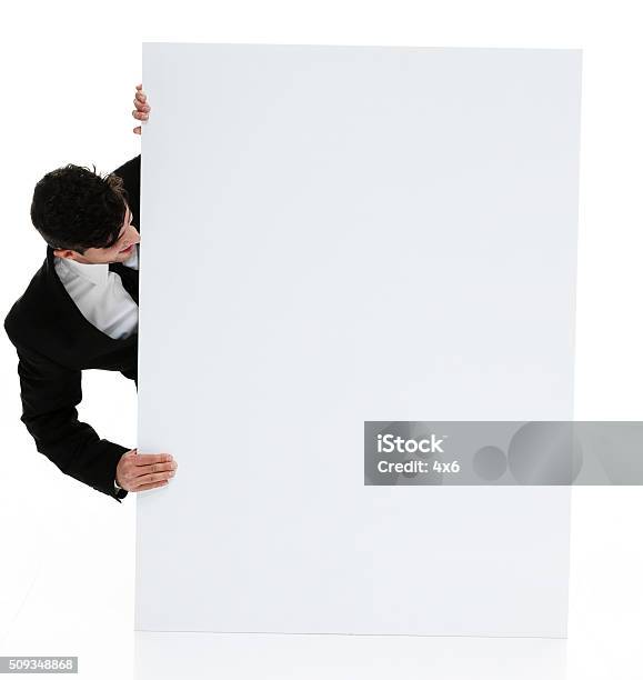 Businessman Showing Placard Stock Photo - Download Image Now - 20-24 Years, 20-29 Years, Adult