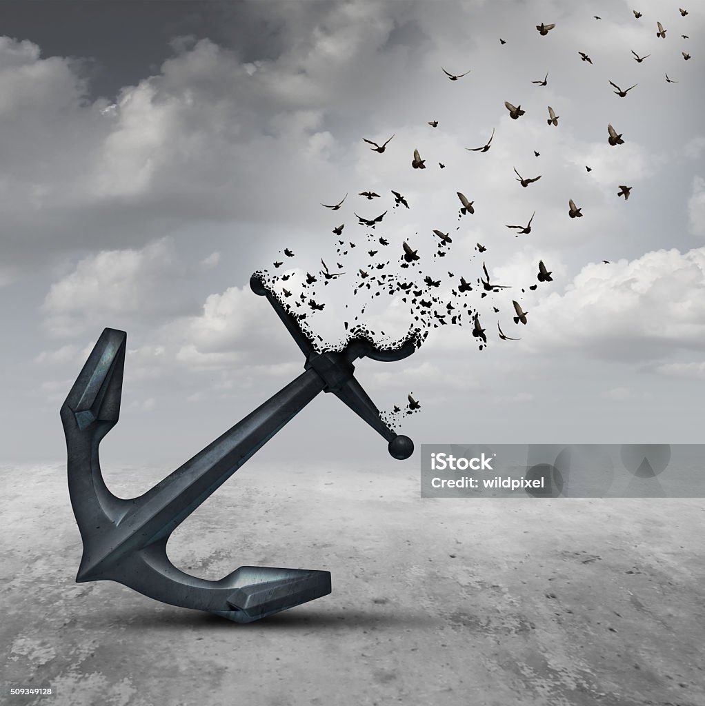 Letting Go Letting go psychology concept as a heavy anchor transforming into a flying group of birds as a motivational metaphor for liberation and leaving a life or business burden behind. Releasing Stock Photo