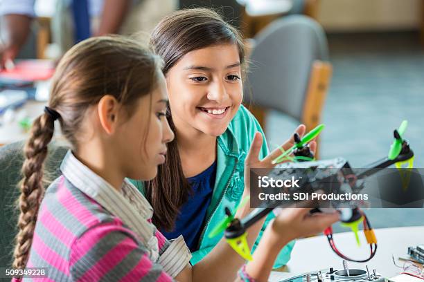 Elementary Girls Using Drones During After School Science Program Stock Photo - Download Image Now