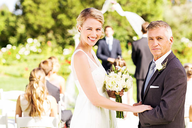 istock Bride And Father Walking Up the Aisle At Garden Wedding 509350185