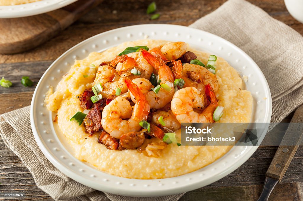 Homemade Shrimp and Grits Homemade Shrimp and Grits with Pork and Cheddar Grits Stock Photo