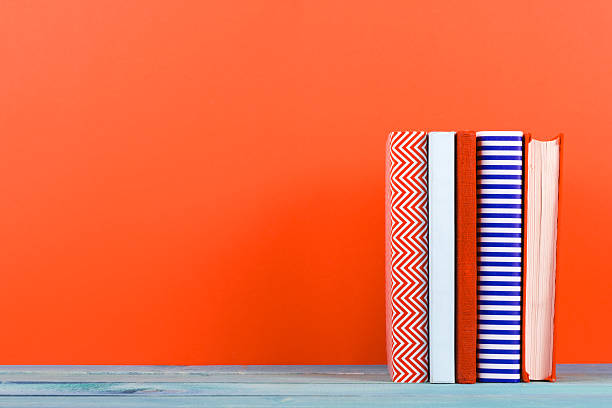 istock Composition with vintage old hardback books, diary, fanned pages 509351332