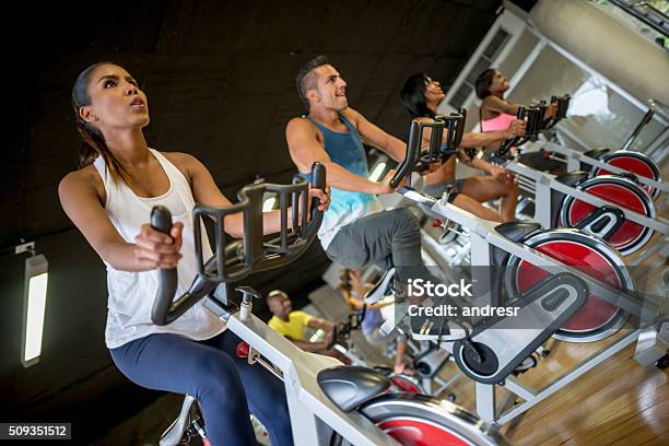 People Exercising At The Gym Stock Photo - Download Image Now - Cycling, Exercising, Healthy Lifestyle