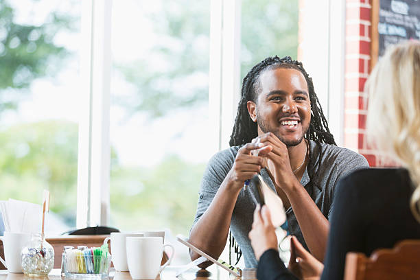 istock Multiracial couple in coffee shop talking 509352634
