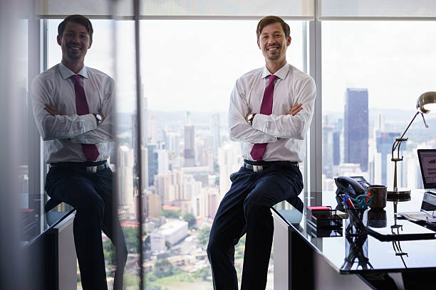 istock Portrait Of White Collar Worker Smiling At Camera In Office 509353154
