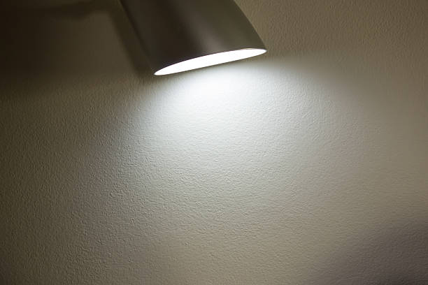 istock The lamp lighting on the concrete wall 509353318