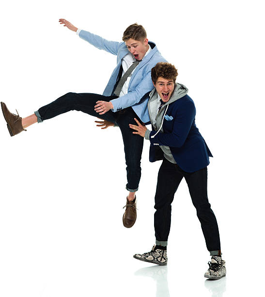 istock Excited two males cheering and jumping 509353842