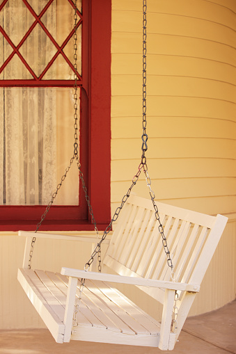 Porch swing loveseat bench nostalgic home furnishing decor from the 1940s and 1950s.