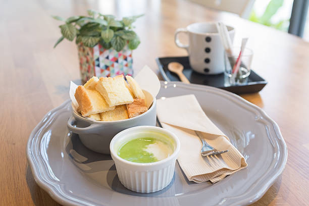 An authentic thai steamed bread with green pandan dipping sauce