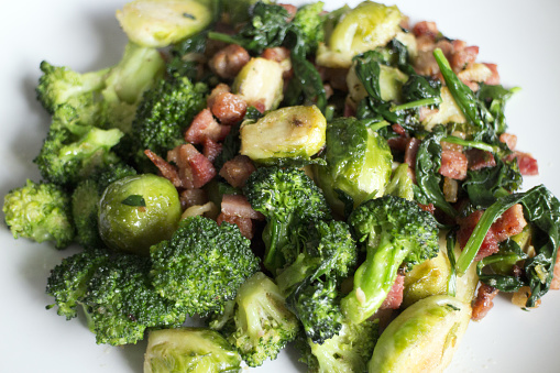 Stir-fried pancetta bacon, brussel sprouts, broccoli, spinach, and garlic.