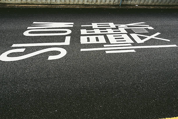 istock SLOW sign on road of city downtown 509357302