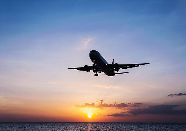 istock Plane with sky sunset and sea 509359112