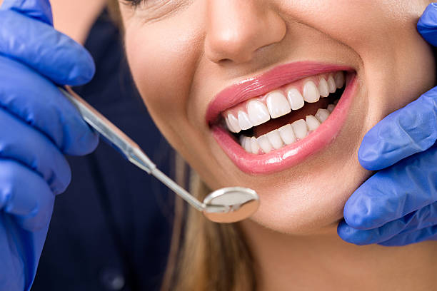 istock Smiling woman at dentist 509360212
