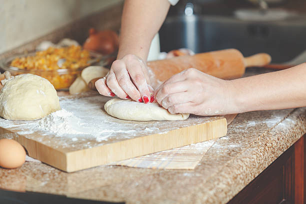 istock Female hands fasten halves patty 509360790